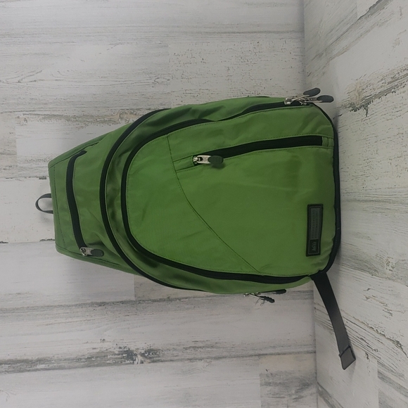 REI Handbags - *HOST PICK* REI green black single strap sling backpack many zippers and pockets